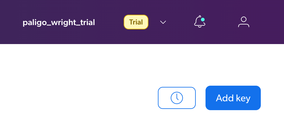 Top-right corner of Coveo header. There is the name of the account, a notifications bell, a user icon and below those a clock icon and an Add Key button.