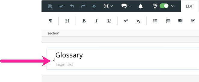Glossary topic open in Paligo editor. An arrow points to the cursor which is positioned below the Glossary title element but above the first para element.